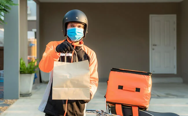 Food delivery guy waiting at your door