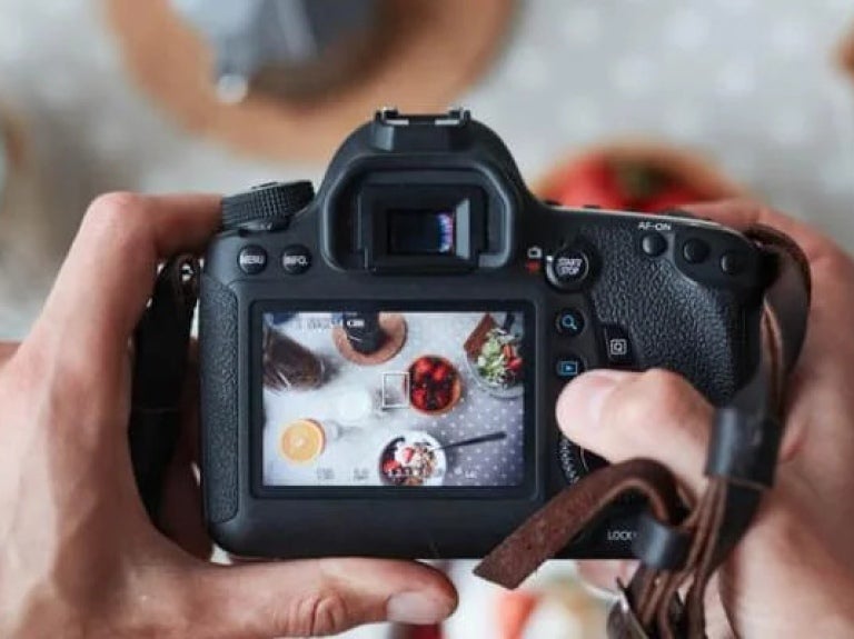 Professional food-photographer making shot of food for advert